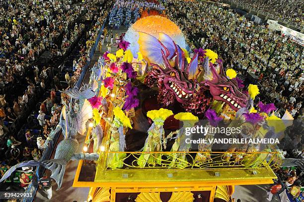 Revelers of the Academicos do Salgueiro samba school perform atop a float during the second night of Carnival parade at the Sambadrome in Rio de...