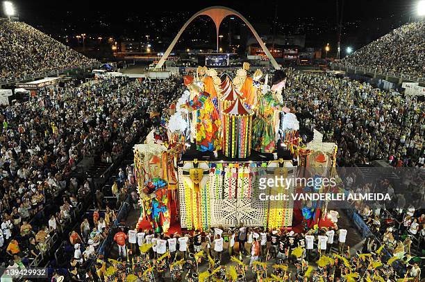 Revelers of the Academicos do Salgueiro samba school perform atop a float during the second night of Carnival parade at the Sambadrome in Rio de...