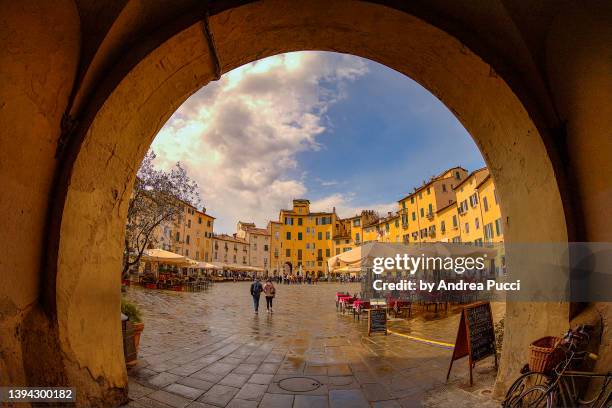 piazza anfiteatro, lucca, tuscany, italy - lucca stock pictures, royalty-free photos & images