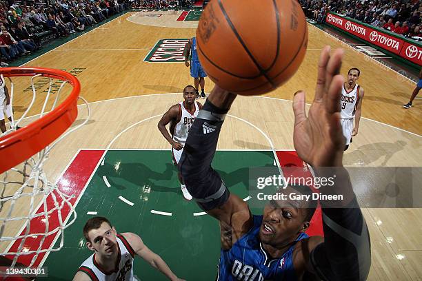 Dwight Howard of the Orlando Magic goes to the basket against Jon Leuer of the Milwaukee Bucks during the game on February 20, 2012 at the Bradley...