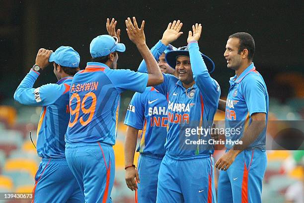 Virender Sehwag of India celebrates with team mates after catching Mahela Jayawardena of Sri Lanka during game eight of the One Day International...