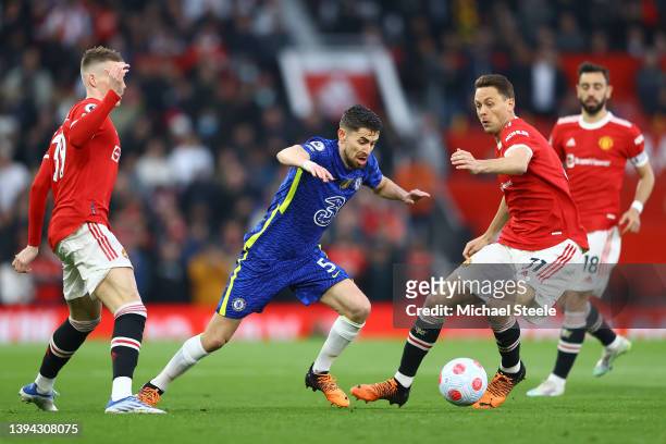 Jorginho of Chelsea cuts between Nemanja Matic and Scott McTominay of Manchester United during the Premier League match between Manchester United and...
