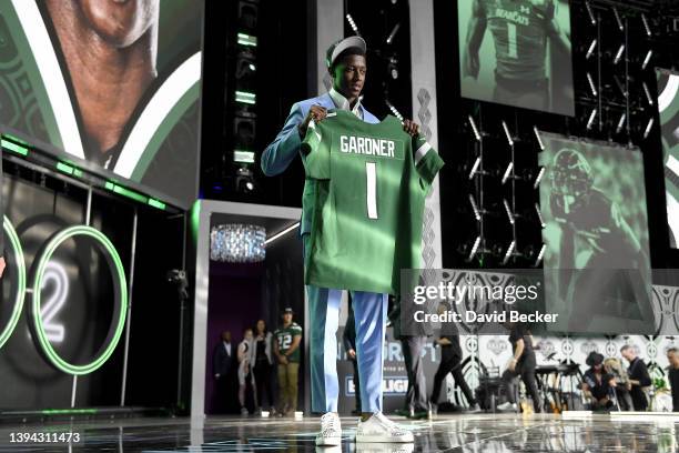 Ahmad Gardner poses onstage after being selected fourth by the New York Jets during round one of the 2022 NFL Draft on April 28, 2022 in Las Vegas,...