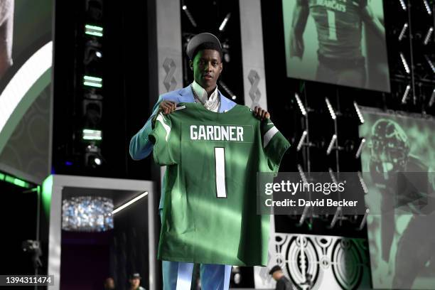 Ahmad Gardner poses onstage after being selected fourth by the New York Jets during round one of the 2022 NFL Draft on April 28, 2022 in Las Vegas,...
