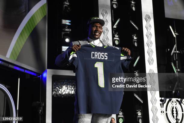 Charles Cross poses onstage after being selected ninth by the Seattle Seahawks during round one of the 2022 NFL Draft on April 28, 2022 in Las Vegas,...