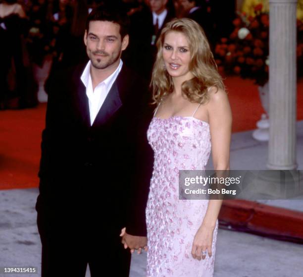 American actor Eddie Cibrian and wife, American television personality, author, fashion designer, and model Brandi Glanville, pose for a portrait...