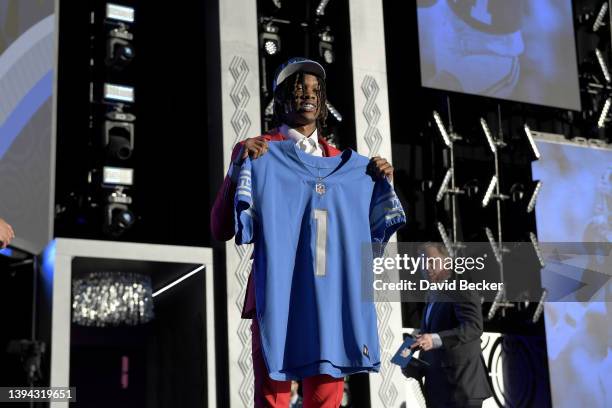 Jameson Williams poses onstage after being selected 12th by the Detroit Lions during round one of the 2022 NFL Draft on April 28, 2022 in Las Vegas,...