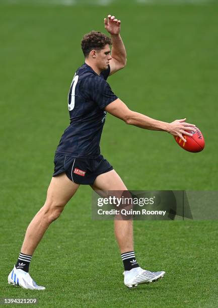 Charlie Curnow of the Blues kicks during a Carlton Blues AFL training session at Ikon Park on April 29, 2022 in Melbourne, Australia.