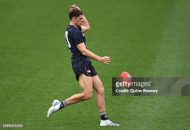 Charlie Curnow of the Blues kicks during a Carlton Blues AFL training session at Ikon Park on April 29, 2022 in Melbourne, Australia.