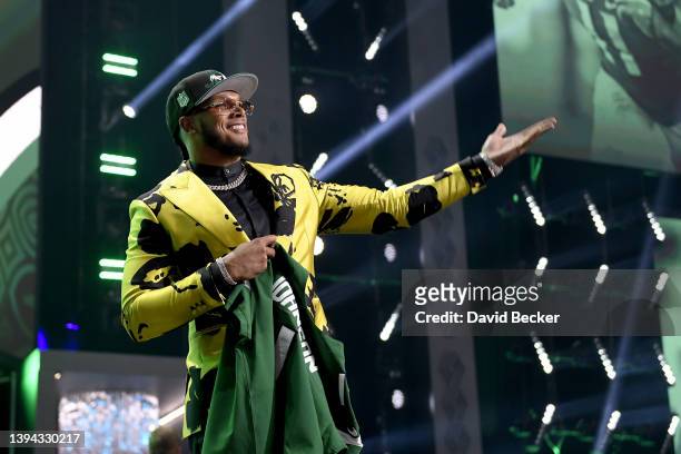 Jermaine Johnson II poses onstage after being selected 26th by the New York Jets during round one of the 2022 NFL Draft on April 28, 2022 in Las...