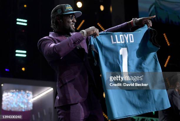 Devin Lloyd poses onstage after being selected 27th by the Jacksonville Jaguars during round one of the 2022 NFL Draft on April 28, 2022 in Las...