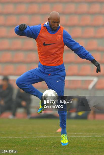 French football player Nicolas Anelka of Shanghai Shenhua warms up prior to a warm-up match between Shanghai Shenhua and Hunan Xiangtao at Shenhua...