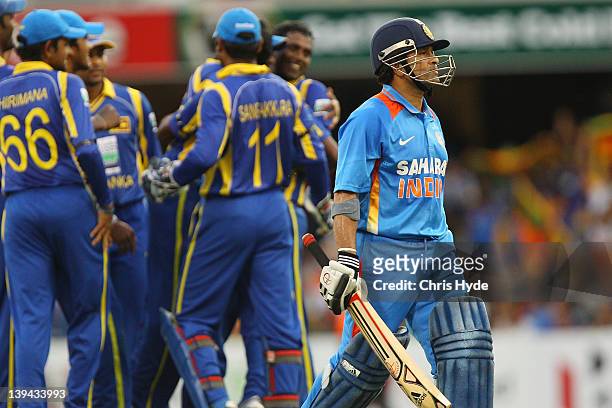Sachin Tendulkar of India leaves the field after being bowled out by Nuwan Kulasekara of Sri Lanka during game eight of the One Day International...
