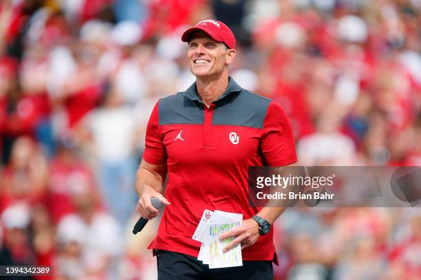 Head coach Brent Venables of the Oklahoma Sooners smiles as he talks to the crowd during their spring game at Gaylord Family Oklahoma Memorial...