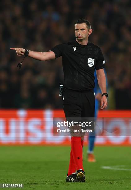 Referee Michael Oliver gestures during the UEFA Conference League Semi Final Leg One match between Feyenoord and Olympique Marseille at De Kuip on...