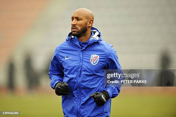 French striker Nicolas Anelka warms up before his team Shanghai Shenhua plays in a friendly match against Hunan Xiangtao at their training ground in...