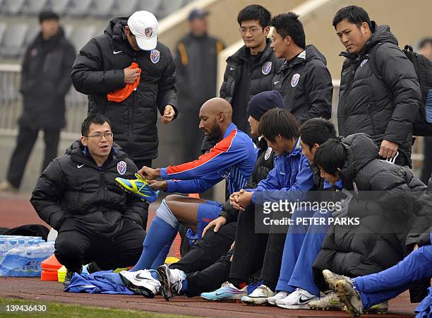 French striker Nicolas Anelka prepares before his team Shanghai Shenhua plays in a friendly match against Hunan Xiangtao at their training ground in...