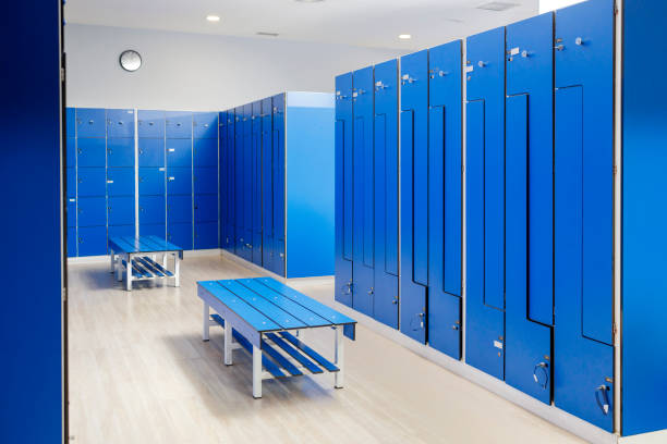 empty blue locker room at gym - locker room stock pictures, royalty-free photos & images