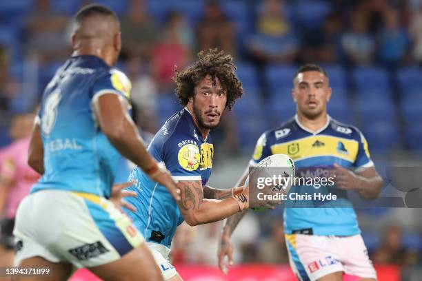 Kevin Proctor of the Titans passes during the round 8 NRL match between the Titans and the Panthers at Cbus Super Stadium, on April 29 in Gold Coast,...