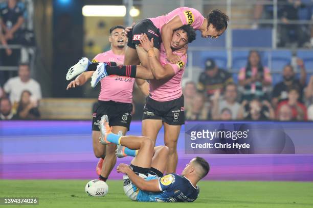 Izack Tago of the Panthers celebrates a try during the round 8 NRL match between the Titans and the Panthers at Cbus Super Stadium, on April 29 in...