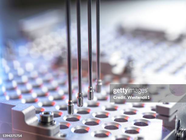 analysis of samples in microplates using automation robotics at laboratory - robotics stock pictures, royalty-free photos & images