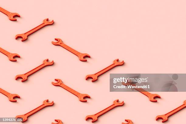 illustrations, cliparts, dessins animés et icônes de three dimensional pattern of rows of orange colored wrenches flat laid against beige background - outil de bricolage