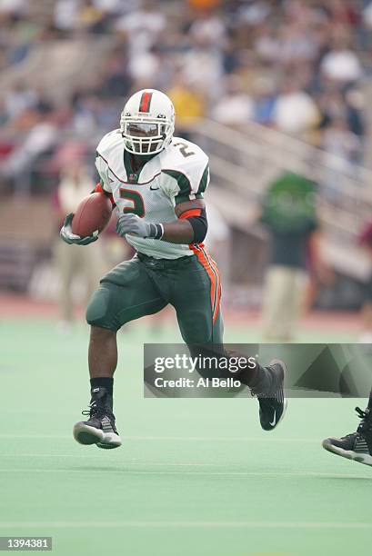 Willis McGahee of the Miami Hurricanes rushes against the Temple Owls during their game on September 14, 2002 at Franklin Field in Philadelphia,...