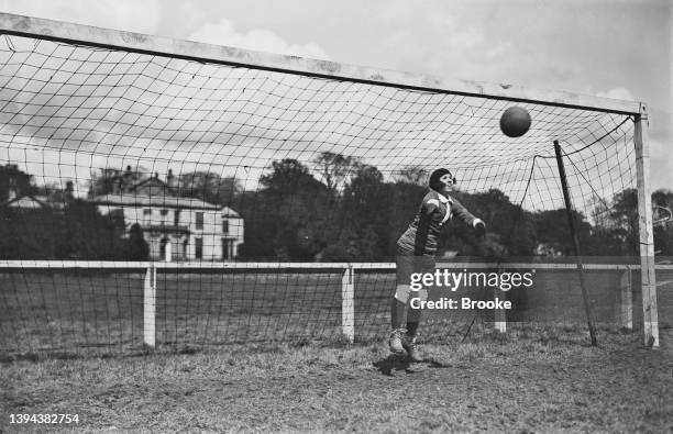 The goalkeeper of the French women's soccer team at a training session before their first international match against the English team Dick, Kerr...