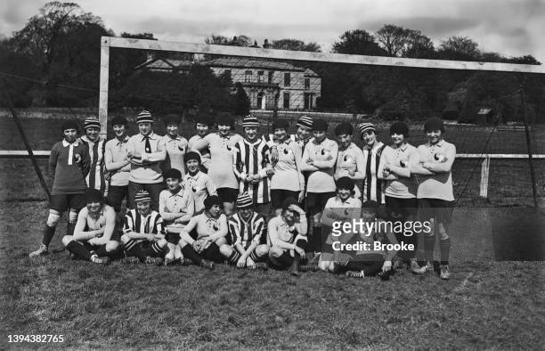 The French women's soccer team together with Dick, Kerr Ladies F.C representing England, in a group photo ahead of their first international match,...