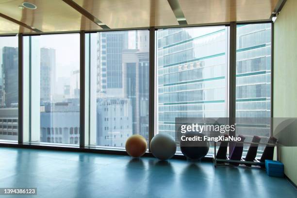 yoga studio workout area in urban city environment - yoga studio stock pictures, royalty-free photos & images
