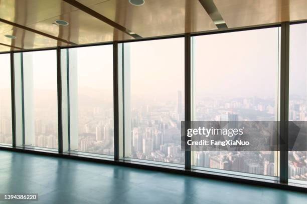 view from office of glass wall windows to urban city - smog city stock pictures, royalty-free photos & images