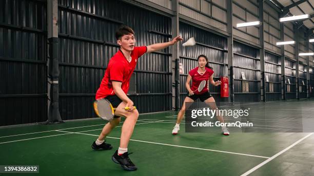 《badminton spirit》mixed doubles defensive - badminton smash stock pictures, royalty-free photos & images