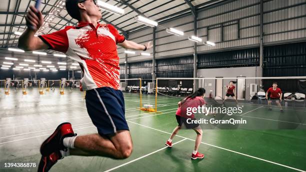 《badminton spirit》jump smash during the match - badminton smash stock pictures, royalty-free photos & images