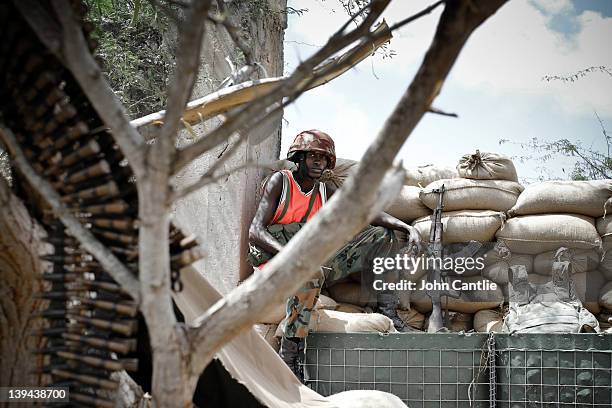Burundi soldiers reinforce positions in a building taken from al Shabaab militants two days earlier near Afgooye on February 20, 2012 in Mogadishu,...