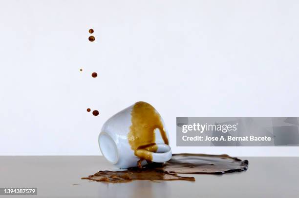 splashes and stains from a cup of coffee dropped on the floor. - porcelain floor stock pictures, royalty-free photos & images