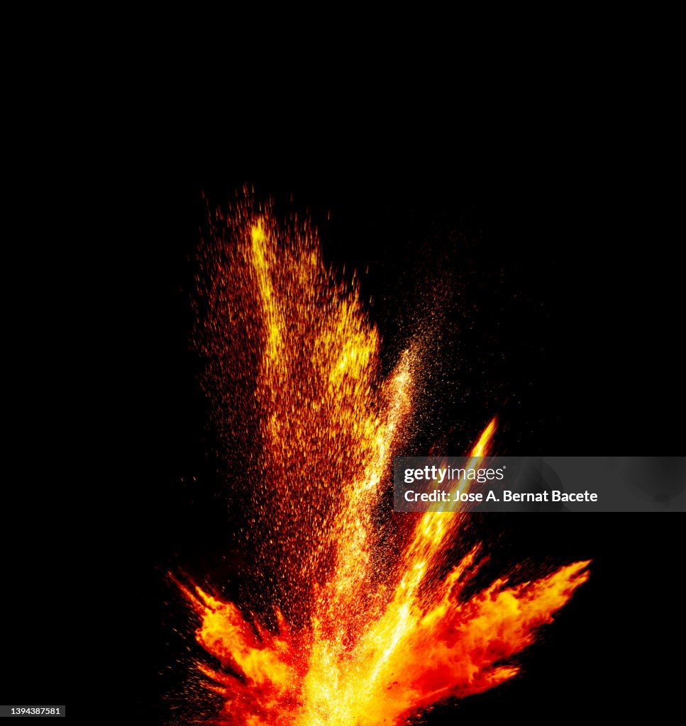 Fire and smoke from an explosion on a black background.