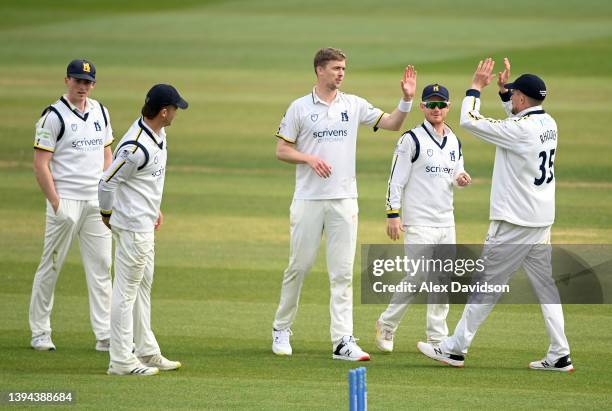 Craig Miles of Warwickshire celebrates taking the wicket of Tom Banton of Somerset with teammates during Day Two of the LV= Insurance County...