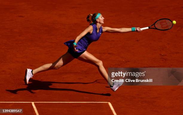 Petra Kvitova of the Czech Republic plays a forehand against Jil Teichmann of Switzerland in their first round match during day two of the Mutua...