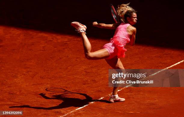 Camila Giorgi of Italy serves against Jessica Pegula of the United States in their first round match during day two of the Mutua Madrid Open at La...