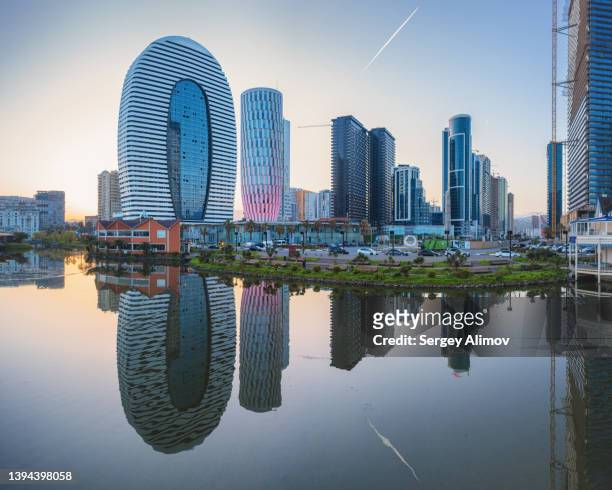 modern skyscrapers reflected in lake - georgian stock pictures, royalty-free photos & images