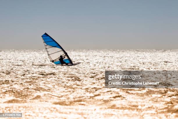 a windsurfer in normandy, france - windsurfbrett stock-fotos und bilder
