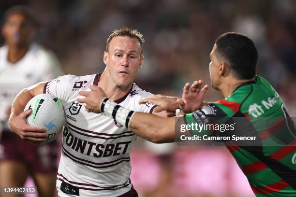 Daly Cherry-Evans of the Sea Eagles is tackled during the round eight NRL match between the South Sydney Rabbitohs and the Manly Sea Eagles at...
