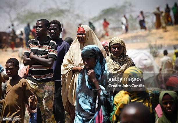 Somalian refugees from the al Shabaab-controlled town of Afgooye make camp on the side of the road on February 20, 2012 in Mogadishu, Somalia. As...