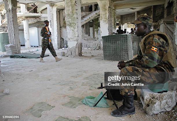 Ugandan soldiers occupy in the smashed remains of the Urubha hotel on February 20, 2012 in Mogadishu, Somalia. As operations against Al Shabaab...