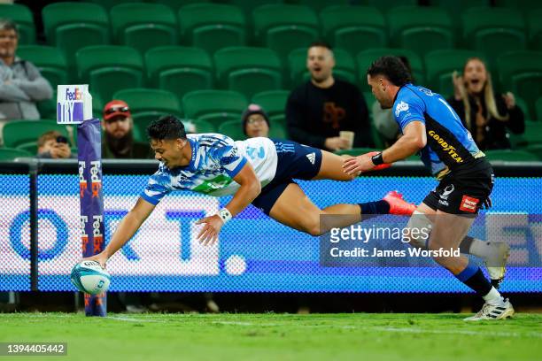 Lam of the Blues leaps for the try line to score a try during the round 11 Super Rugby Pacific match between the Western Force and the Blues at HBF...
