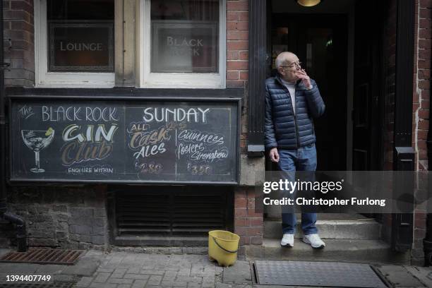 Man stands outside a pub in Wakefield City centre as Labour's Shadow Chancellor Rachel Reeves takes part in a campaign event for local elections on...