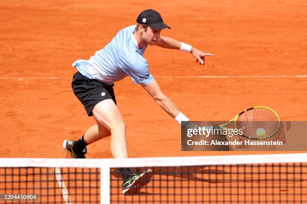 Botic van de Zandschlup of Netherlands plays a backhand during his quater-final match against Casper Ruud of Norwayon day seven of the BMW Open by...