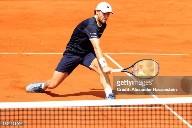 Casper Ruud of Norway plays a back hand during his quater-final match against Botic van de Zandschlup of Netherlands on day seven of the BMW Open by...