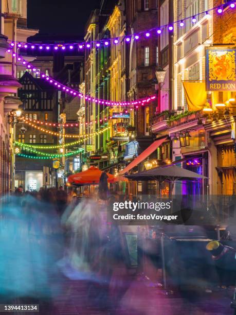 london soho crowds in busy bars restaurants pubs at night - covent garden stock pictures, royalty-free photos & images