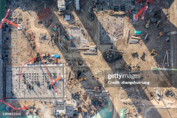 aerial view of construction site - baustelle gerüst sonne stock-fotos und bilder